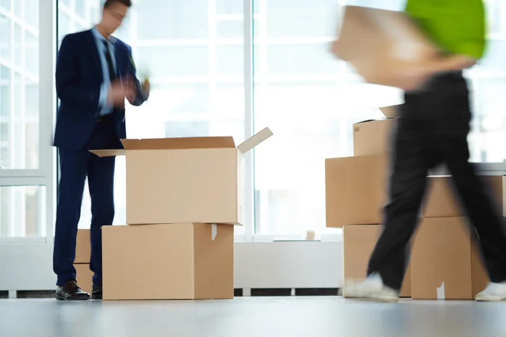 commercial movers carrying boxes