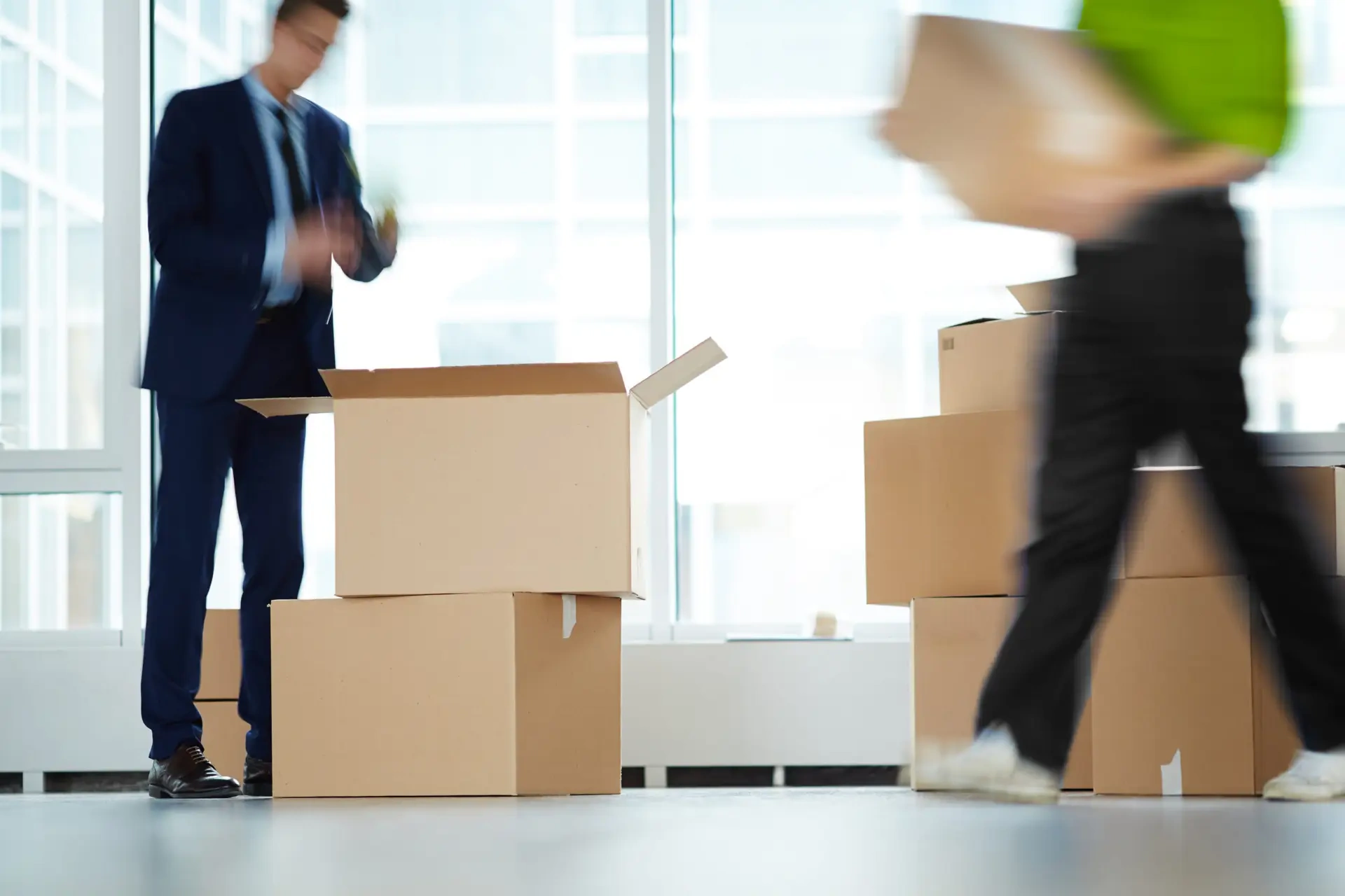 commercial movers carrying boxes