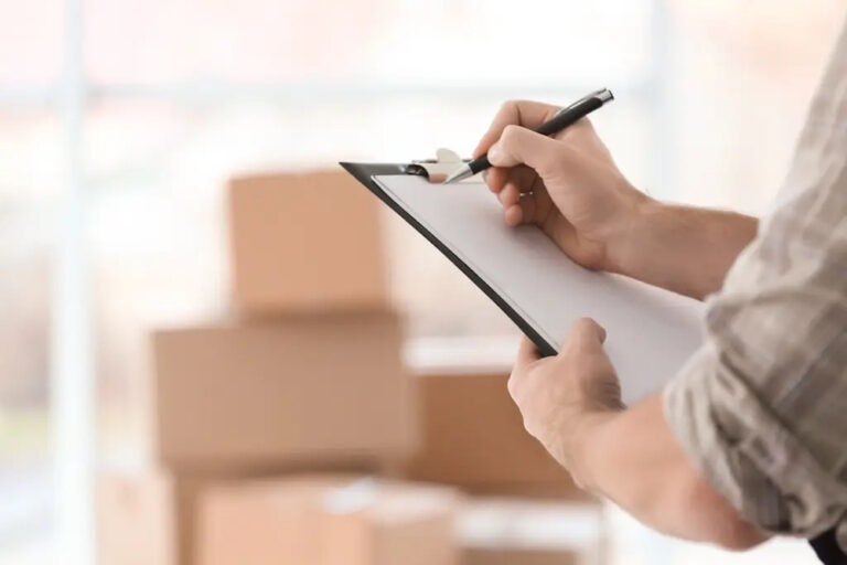 man checking off moving checklist